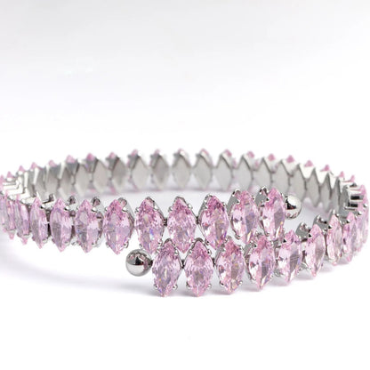 Pink tiara with silver accents on a white background