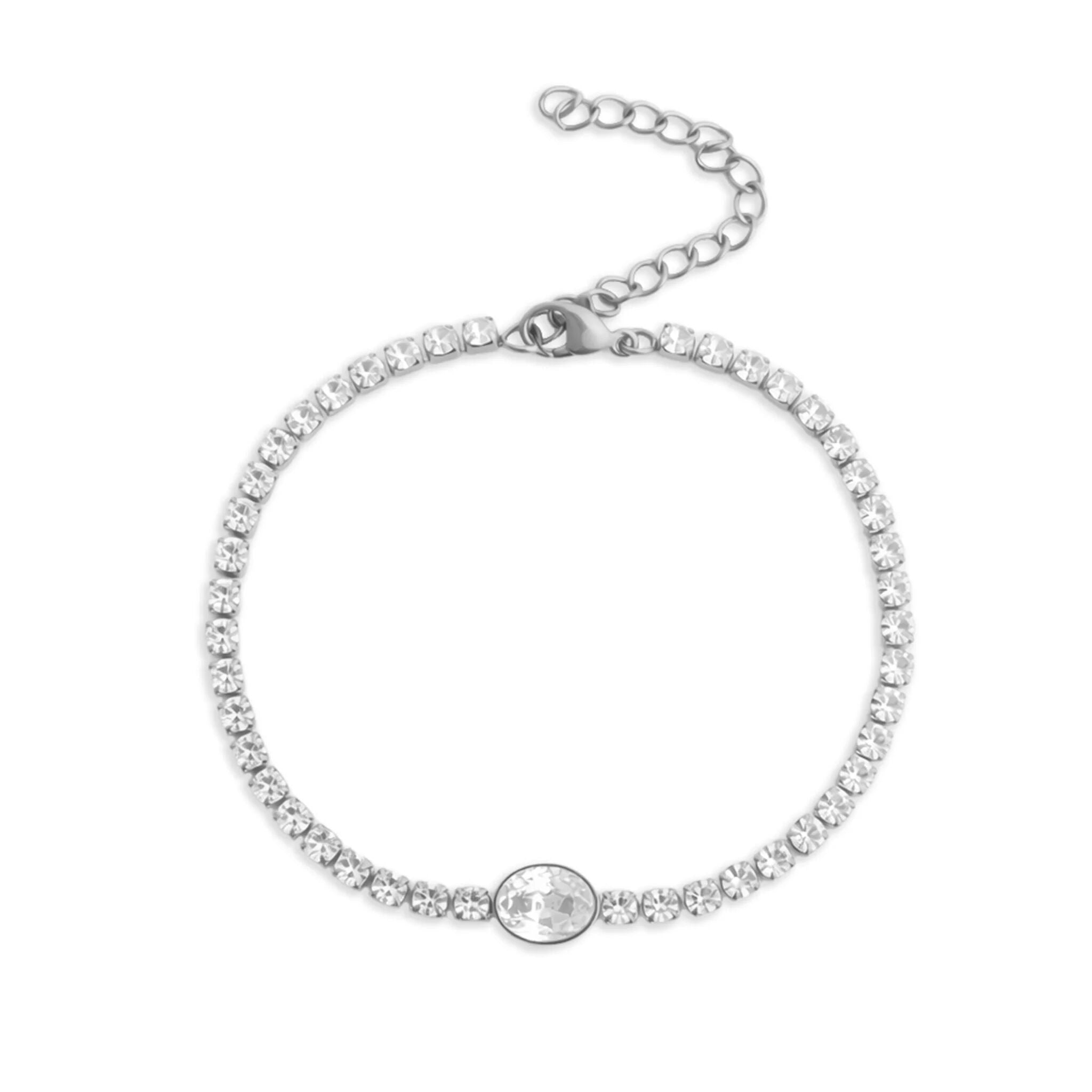 Silver bracelet with clear stones on a white background