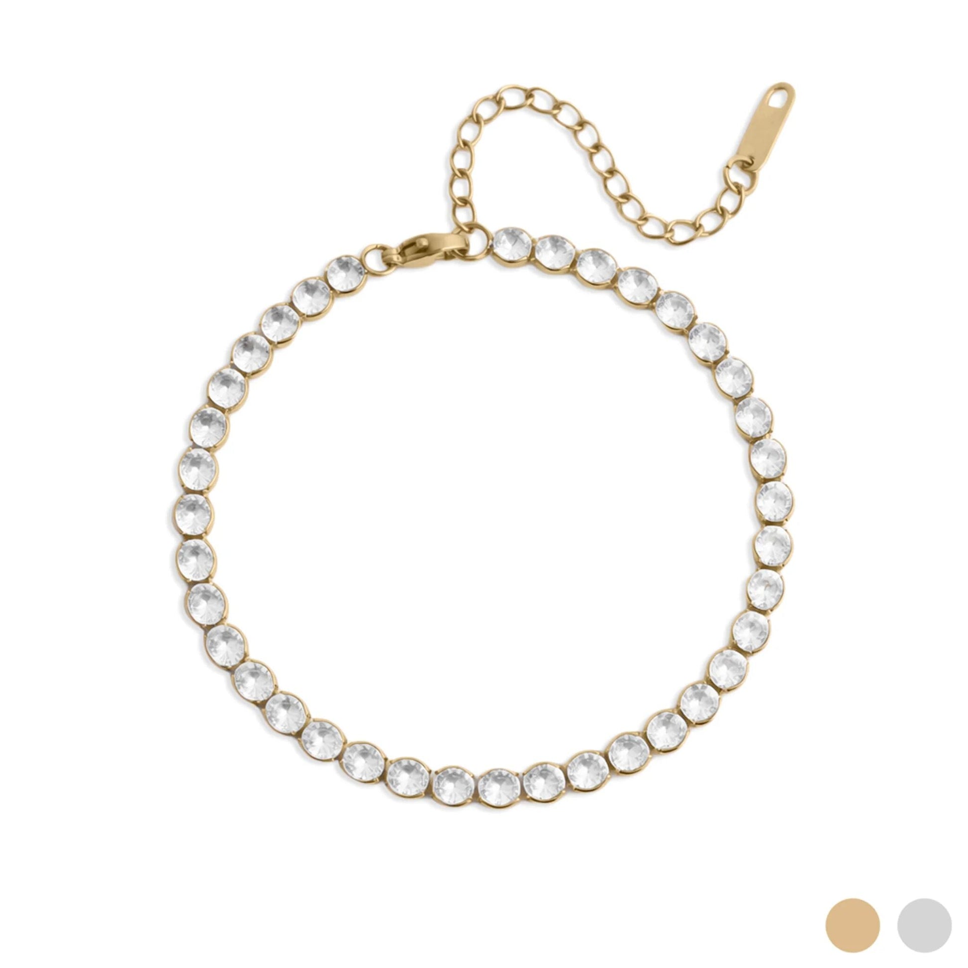Gold bracelet with clear gemstones on a white background