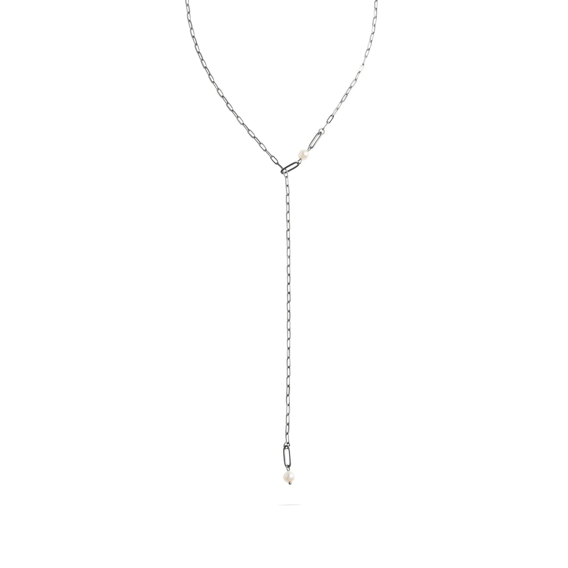 Silver lariat necklace on a white background