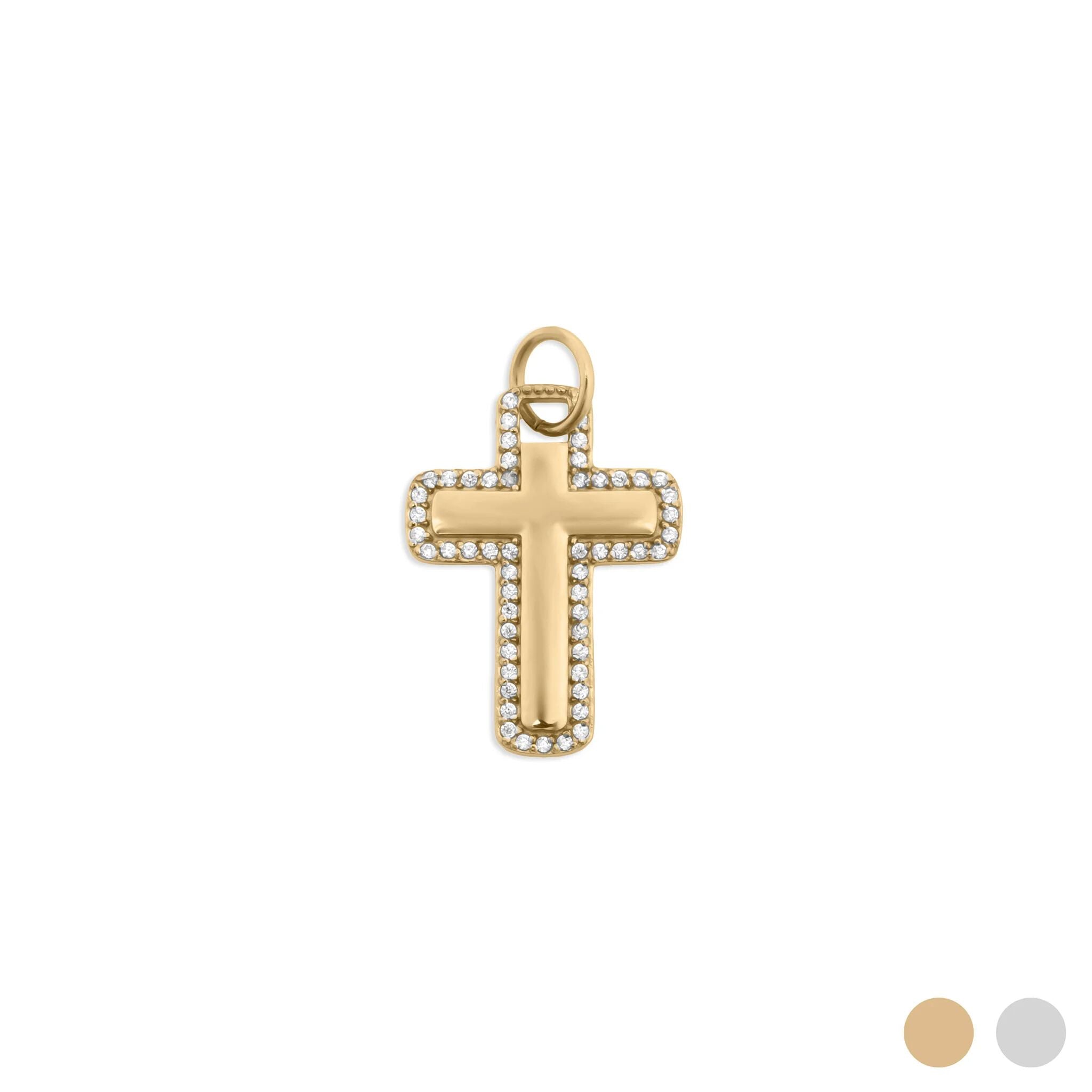 Gold cross pendant with embedded stones on a white background