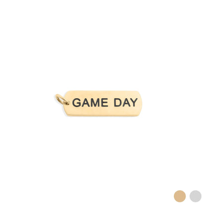 Gold pendant with 'GAME DAY' engraving on a white background