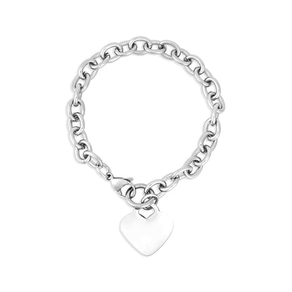A silver stainless steel heart-shaped bracelet with a blank space for engraving, displayed against a white background.